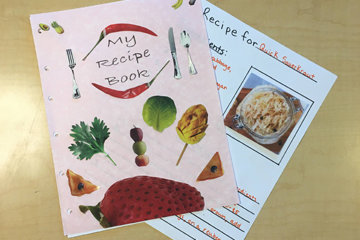 Cover and interior page of a decorated homemade recipe book