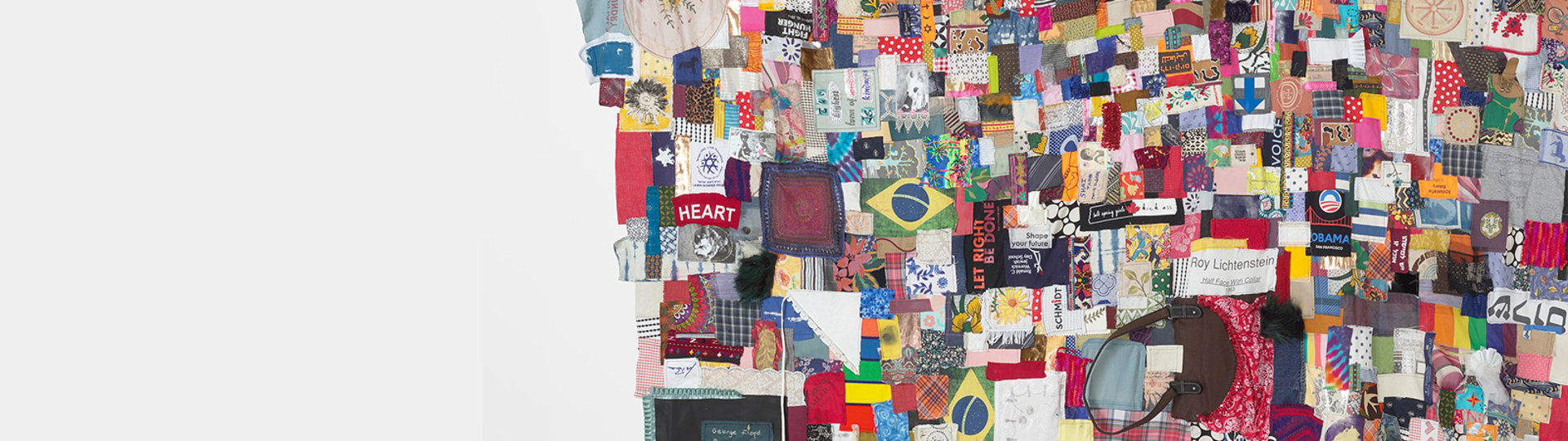 Photo of A community quilt with many different patches