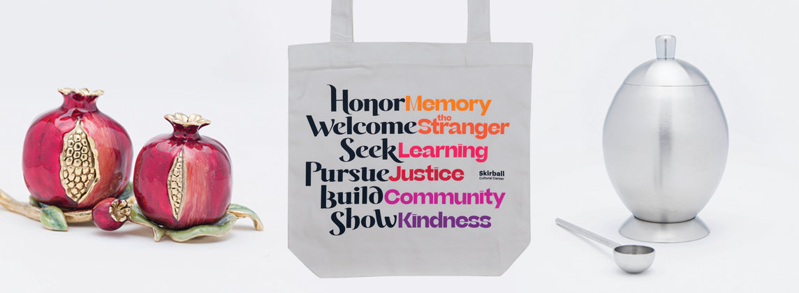 Store items, pomegranate salt and pepper shakes, Skirball tote with values on it, silver honey container