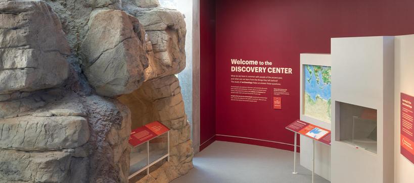 a rock cave at the entrance to the Discovery Center