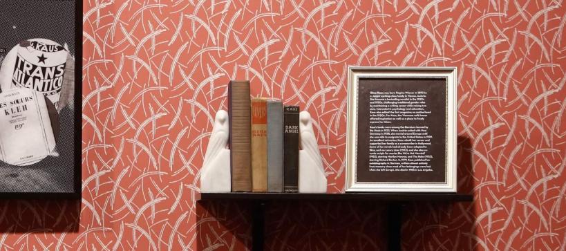 art and books on a small shelf