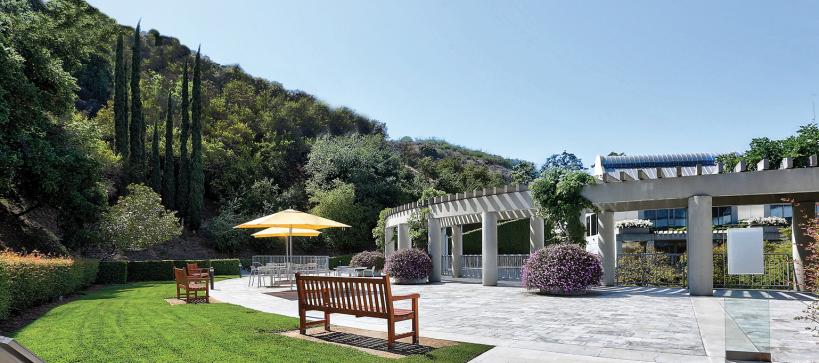 Bench and upper patio of the Skirball next to the hillside