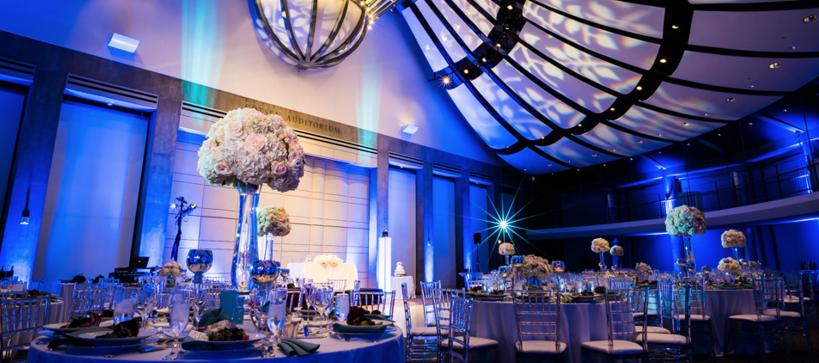 Tables with flowers and place setting ready for an event 