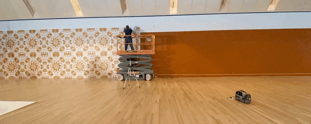 Installing vinyl wallpaper for "Ai Weiwei: Trace" at the Skirball