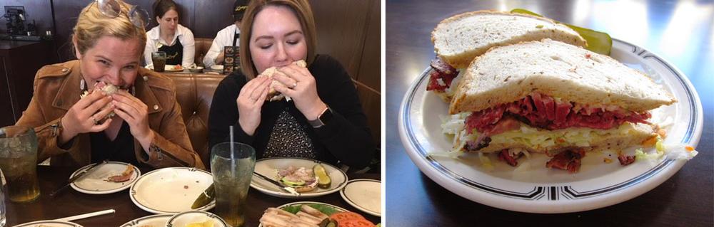 2 women eating sandwiches and a photo fo a pastrami sandwich