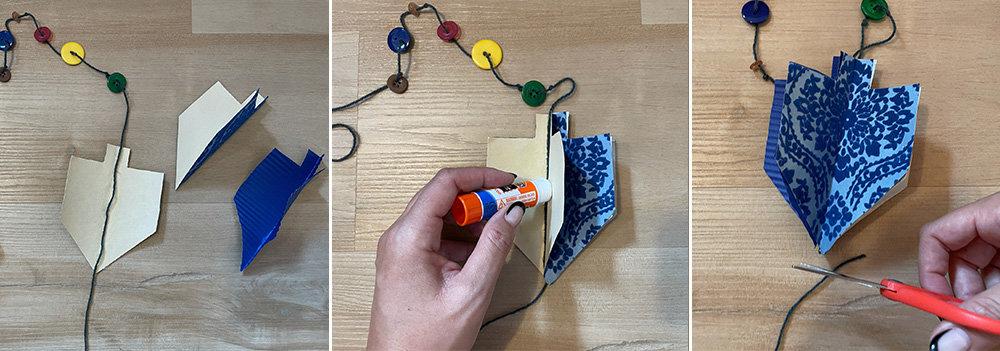 attaching paper dreidel to string and cutting the extra string off