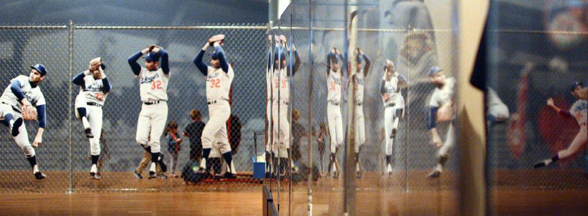 series of photos showing baseball pitcher winding up and throwing ball