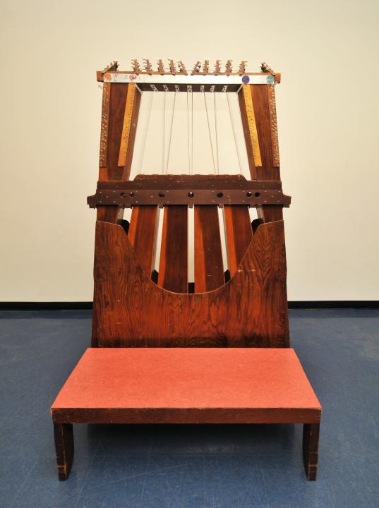 Photo of a sculptural instrument made from wood and string