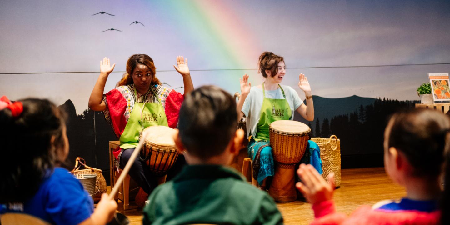 Group of people playing African drums