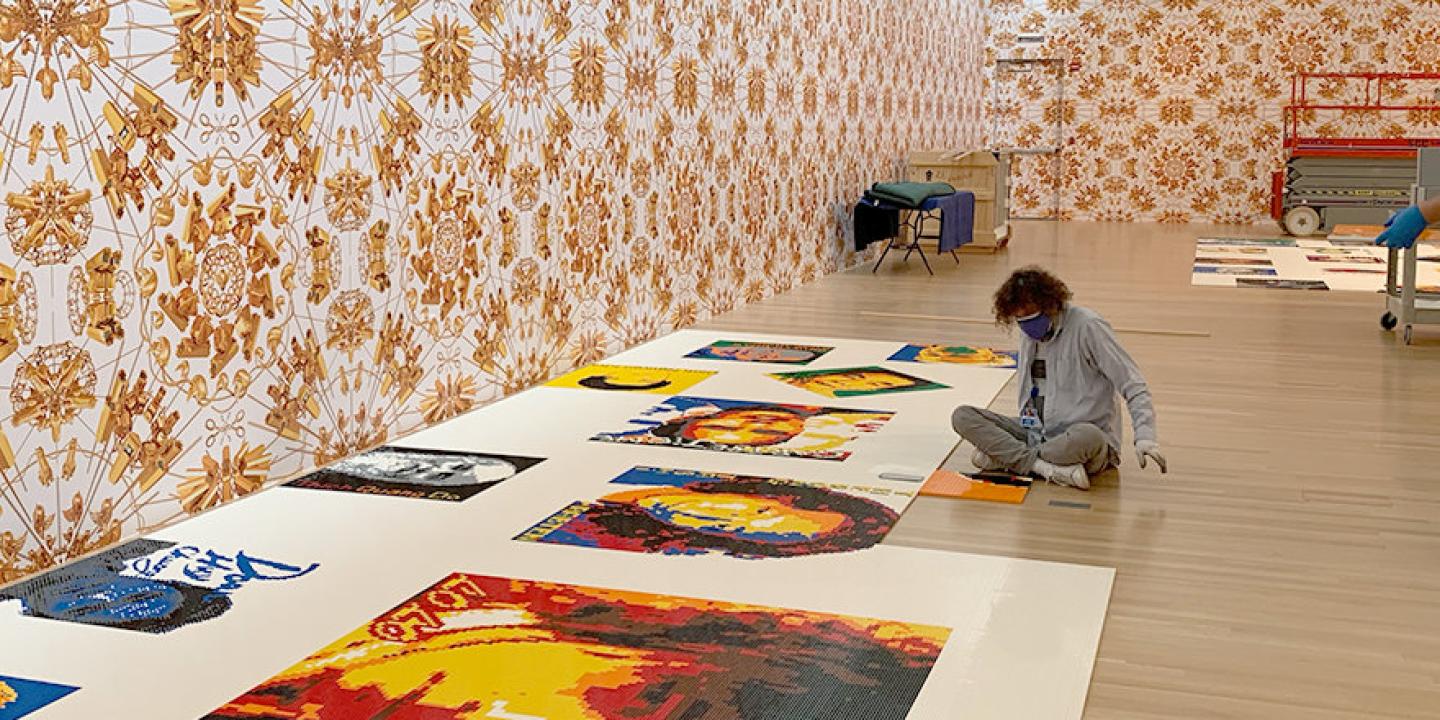 Preparators installing Trace exhibition
