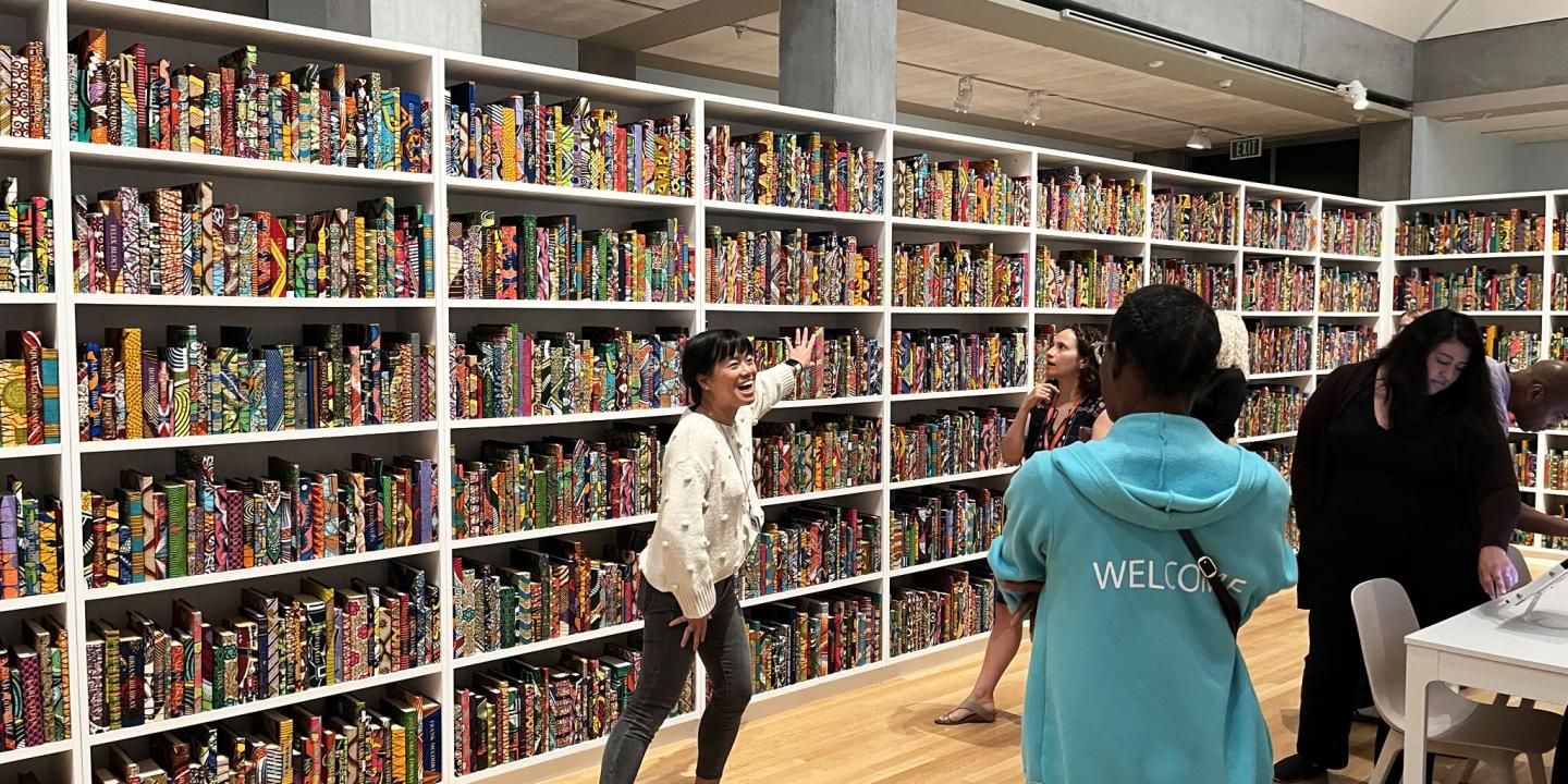 Vicki Phung Smith leads a tour of The American Library.