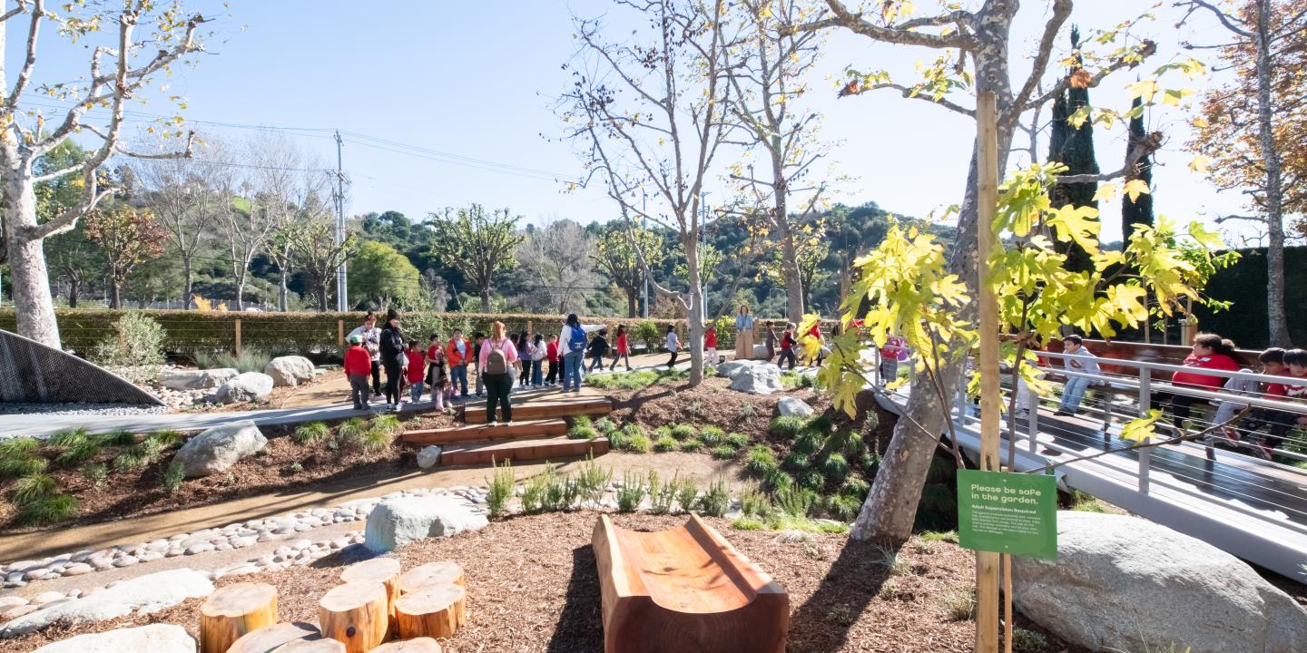 Children walk along the Bloom Garden pathways.
