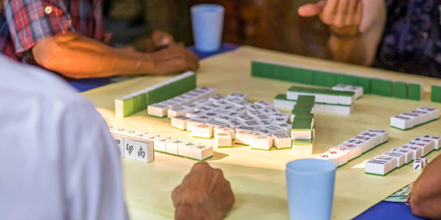 A game table set up with people around it.