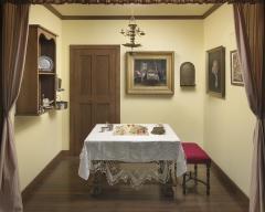 Room with table set for sabbath meal