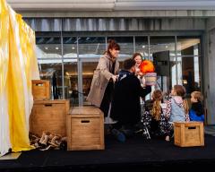 children watching a puppet show