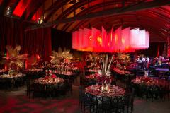 Guerin Pavilion set up for a dramatic evening festive occasion with round tables and colorful place-settings