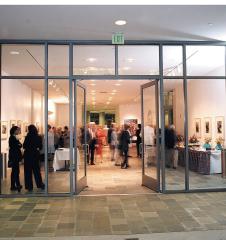 Ruby Commons  with people milling around looking at artwork on the walls