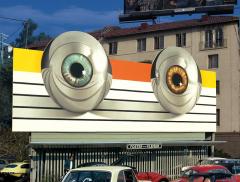 billboard with two large metalic eyes