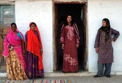 4 women standing in and next to a doorway