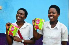 2 young woman holding packages of Go! menstrual pads