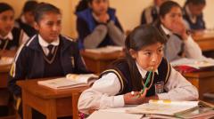 students seated at desks in a classroom