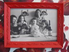 photo of woman and four girls at a table