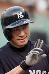 baseball player making a peace sign with his hand