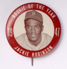 pin with photo of Jackie Robinson and text 'Rookie of the Year 1947 Jackie Robinson'