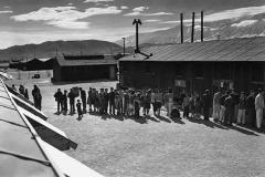 people in a line outside a barrack