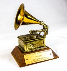 Grammy award (shaped like a early phonograph player) with Paul Simon's name on it