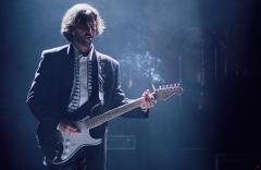 Eric Clapton playing an electric guitar