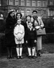 Group photo of 6 people with a young Bill Graham standing in front row