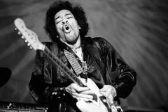 Jimi Hendrix playing a guitar