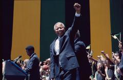 Nelson Mandela with his fist raised over his head