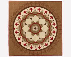 A square brown quilt with a cream and red circle pattern.