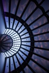 The ceiling of the ballroom showing the architectural details and light projection for an event.