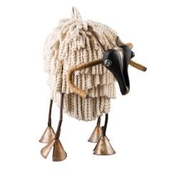 A Ram made of an old bicycle seat for the head and bicycle  handlebars for the horns. The ram’s fluffy body is made from cotton curtain fringe.