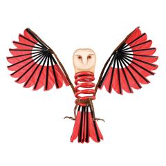 Barn Owl with wings made from red and black Asian fans, wood, and a body composed of industrial steel coil