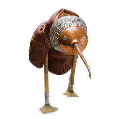 A Brown Kiwi made from antique boxing gloves, paintbrushes for legs, and a tarnished old oil can for a head