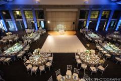 An elegant table set up in white ready for a wedding.