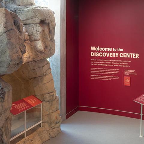 a rock cave at the entrance to the Discovery Center