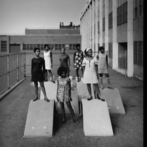 2 black and white photos, one of a woman and one of a group fo women standing next to a building