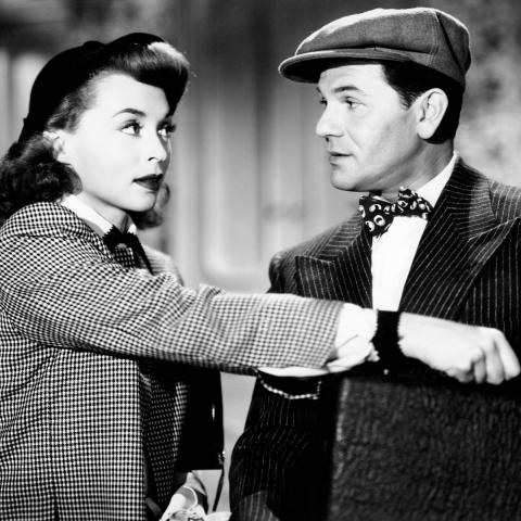 Still from the films featured. On the left is a woman and man sitting on board a boat looking out to the left. On the right shows a woman reaching over into the jacket pocket of a man facing her. They are making eye contact.