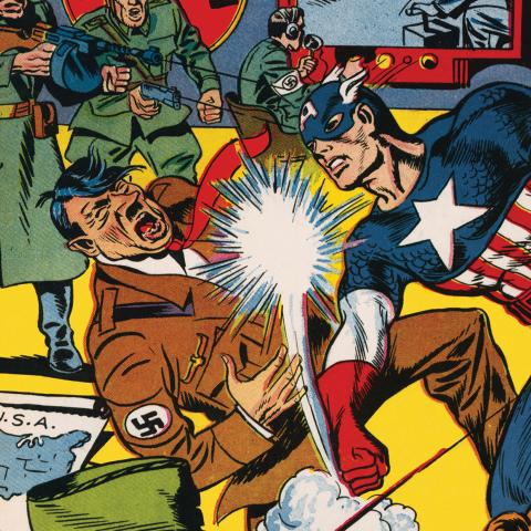 A coming book cover with super hero Captain America punching Hitler in the face.