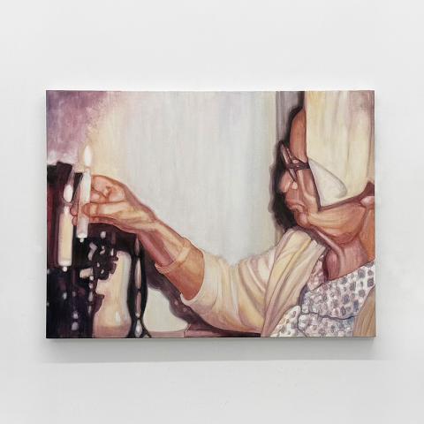 Three paintings on a gallery wall depicting candles with the one in the middle a person lighting one.