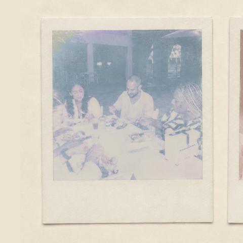 Two faded out polaroid photos of people at a table.