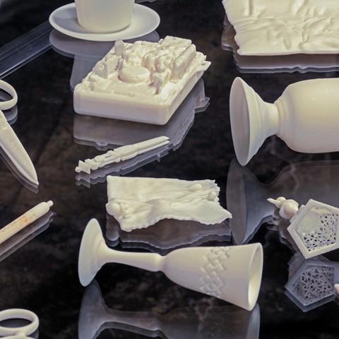 Everyday objects made of white resin like cups and scissors