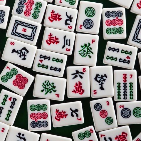 Colorful game tiles with symbols on them.