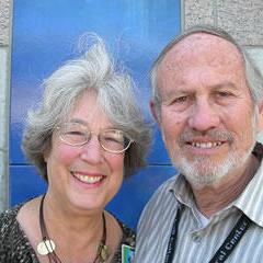 An older woman and man smiling at the camera