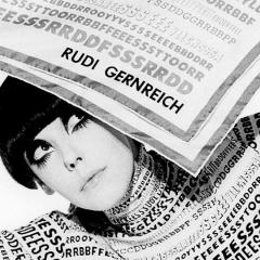 woman with large painted eyebrows and eyelashes holding a piece of paper above her head